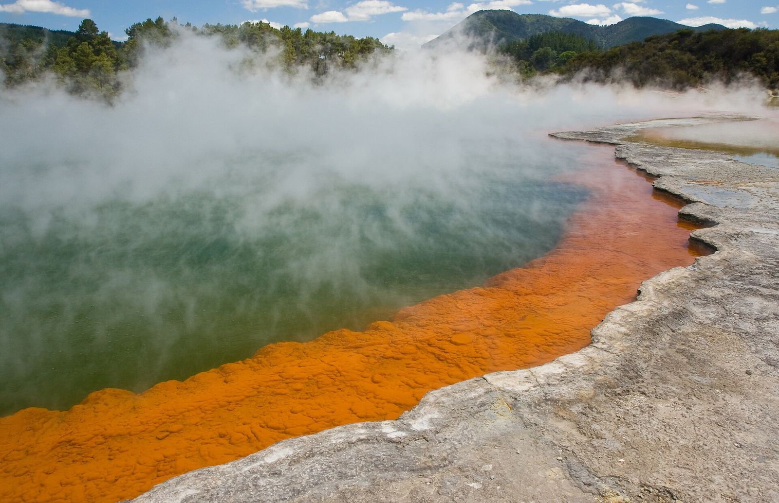 The steaming Champagne Pool at Wai-O-Tapu with its orange edge